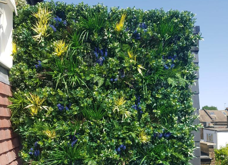 outdoor artificial green wall used as rooftop screening