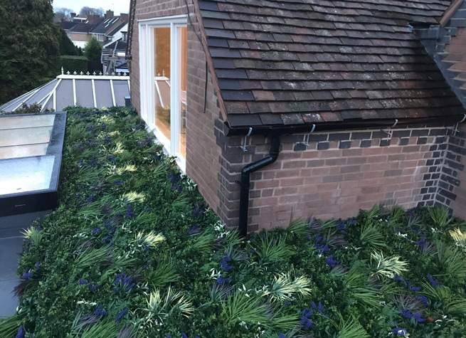 ornamental green roof using artificial green wall panels horizontally