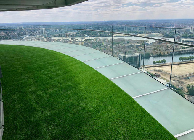 artificial lawn on sky terrace in londons docklands