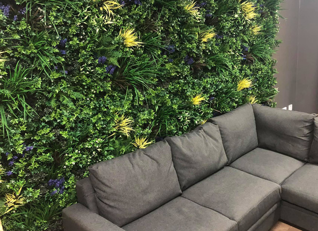 interior artificial green wall with comfy seating