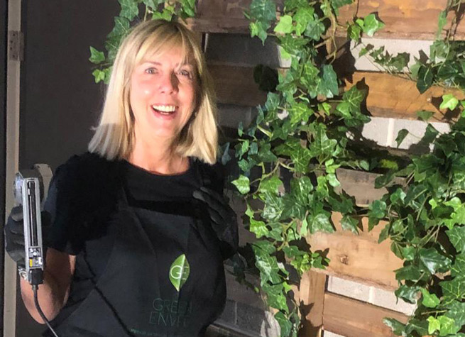 creative installer Julie works on a bespoke artificial plant installation