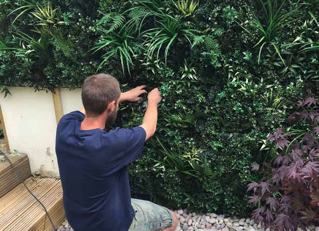 outdoor artificial green wall in difficult space