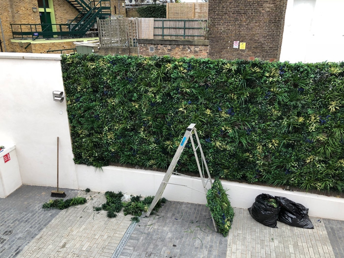 artificial green wall being installed